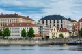 Various colorful historical houses at the bank of Vltava river, and cruise ship on the river, Prague, Czech republic