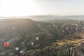 various colorful hot air balloons flying above goreme national park, cappadocia, turkey