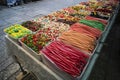 Various colorful jelly sweets and confectionary exposed in plastic boxes for sale in the street. Contrasting colors of candies and