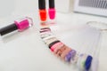 Various colorful nails, manicure palette. Nail polish samples. selective focus