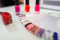 Various colorful nails, manicure palette. Nail polish samples. selective focus