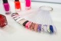 Various colorful nails, manicure palette. Nail polish samples. selective focus