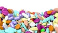 Various colorful pills in a pile with copy-space