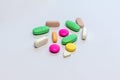 Various colorful pills on white isolated background closeup Royalty Free Stock Photo