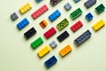 various colorful plastic toy bricks stackable blocks on yellow panoramic background, childhood education construction concept Royalty Free Stock Photo