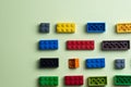 various colorful plastic toy bricks stackable blocks on yellow panoramic background, childhood education construction concept Royalty Free Stock Photo