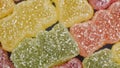 various colorful sour gummy bears as sweets