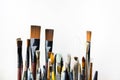 Various colorful used brushes for art on white background Royalty Free Stock Photo