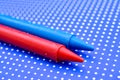 various colors crayons on a blue background Royalty Free Stock Photo