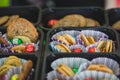 Various colourful biscuits in paper and trays, crunchy dessert for children