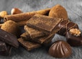 Various confectionery: chocolate, candies on a dark background