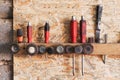 Various construction tools are hanging on the osb board Royalty Free Stock Photo