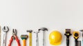 Various construction tools and hard hat arranged on a white background. Concept of construction, tool selection, safety Royalty Free Stock Photo