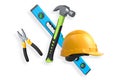 Various construction tools including wrench, hammer, pliers, and helmet isolated on white background with clipping path Royalty Free Stock Photo