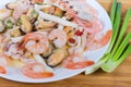 Various cooked seafoods on white dish, fragment close-up Royalty Free Stock Photo