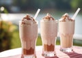 Various creamy milkshakes with whipped cream on cafe table.Macro.AI Generative