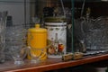 Various crockery under glass in a sideboard, plates and mugs in an old cupboard, a set and set of props for filming and preparing