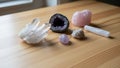 A larger piece of pink rose quartz SiO and a selenite CaSO 2H Royalty Free Stock Photo