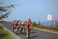 Various cyclists climbing on the road to Paltinis, Romania.