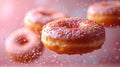 Various decorated donuts in motion falling on pink background. Royalty Free Stock Photo