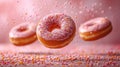 Various decorated donuts in motion falling on pink background. Royalty Free Stock Photo