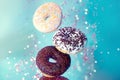 Various decorated doughnuts in motion falling Sweet and colourful donuts Royalty Free Stock Photo