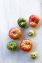 Assorted and delicious tomatoes scattered on marble Royalty Free Stock Photo
