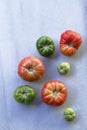 Assorted and delicious tomatoes scattered on marble Royalty Free Stock Photo