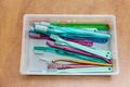 Various dental cleaning brushes in a plastic box