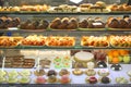 Various dessert sweets and cakes in shop window Royalty Free Stock Photo