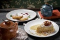 Various desserts, cheese cakes dessert, napoleon cakes, kettle with tea