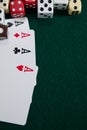 Various dice and playing cards on poker table Royalty Free Stock Photo