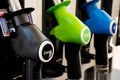 Various diesel and petrol pumps on a gas station. Fuel nozzles oil dispensers. Petrol gas diesel fuel prices concept Royalty Free Stock Photo