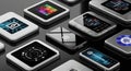 Various digital tablets lie on a reflective black surface, displaying colorful screens with Royalty Free Stock Photo
