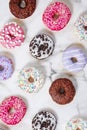 Various donuts on a colorful background. Top view shot.