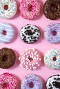 Various donuts on a colorful background. Top view shot.