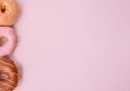 Various donuts on an pink background Royalty Free Stock Photo