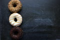 Various donuts on white background, from above. Royalty Free Stock Photo