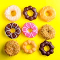 Various Donuts on yellow background