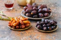 Various of dried dates or kurma in a vintage plates and tea Royalty Free Stock Photo