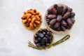 Various of dried dates or kurma in a vintage plates. Top view