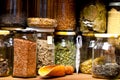 Various Dried Herbs In Glass Jars