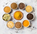 Various dried herbs and spices in ceramic bowls Royalty Free Stock Photo