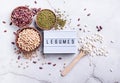 Various dried legumes with lightbox with the text Legumes top view flat lay