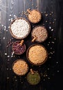 Various dried legumes in wooden bowls top view flat lay on wooden background Royalty Free Stock Photo