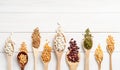 Various dried legumes on wooden spoons top view flat lay with copy space Royalty Free Stock Photo