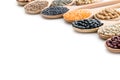 Various dried legumes in wooden spoons Royalty Free Stock Photo