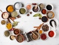 Various dry spices frame flat lay in small bowls on white wood background. Top view, copy space Royalty Free Stock Photo