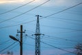 Randomly running electrical wires on poles against the sky Royalty Free Stock Photo