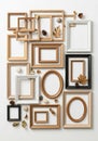 Various empty picture frames are artistically arranged against a plain white Royalty Free Stock Photo